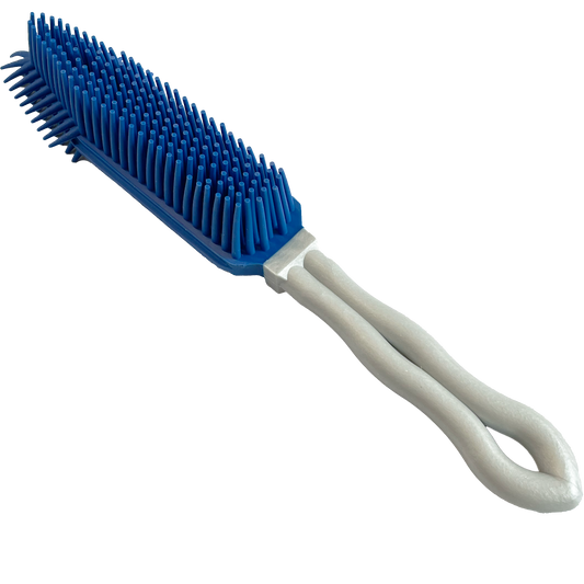 Wheeky® Pets Clean Sweep Brush – Angled view showcasing the textured rubber bristles.